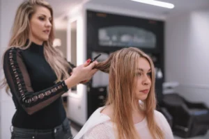 woman setting hair client styling